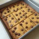 Fresh banana chocolate chip bars in a baking pan