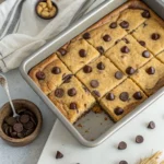 Fresh banana chocolate chip bars in a baking pan