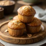 brown butter banana muffins stacked on plate